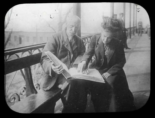 "Library for the Blind, teaching adult blind, city house, Blackwell's Island, woman and man on porch."